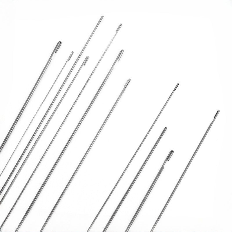 Eight slim metallic hook needles in varying sizes arranged diagonally on a white background.