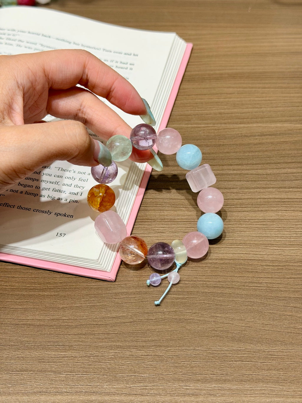 Spring Candy Jar pastel crystal candy bracelet with blue cord dangle worn on wrist