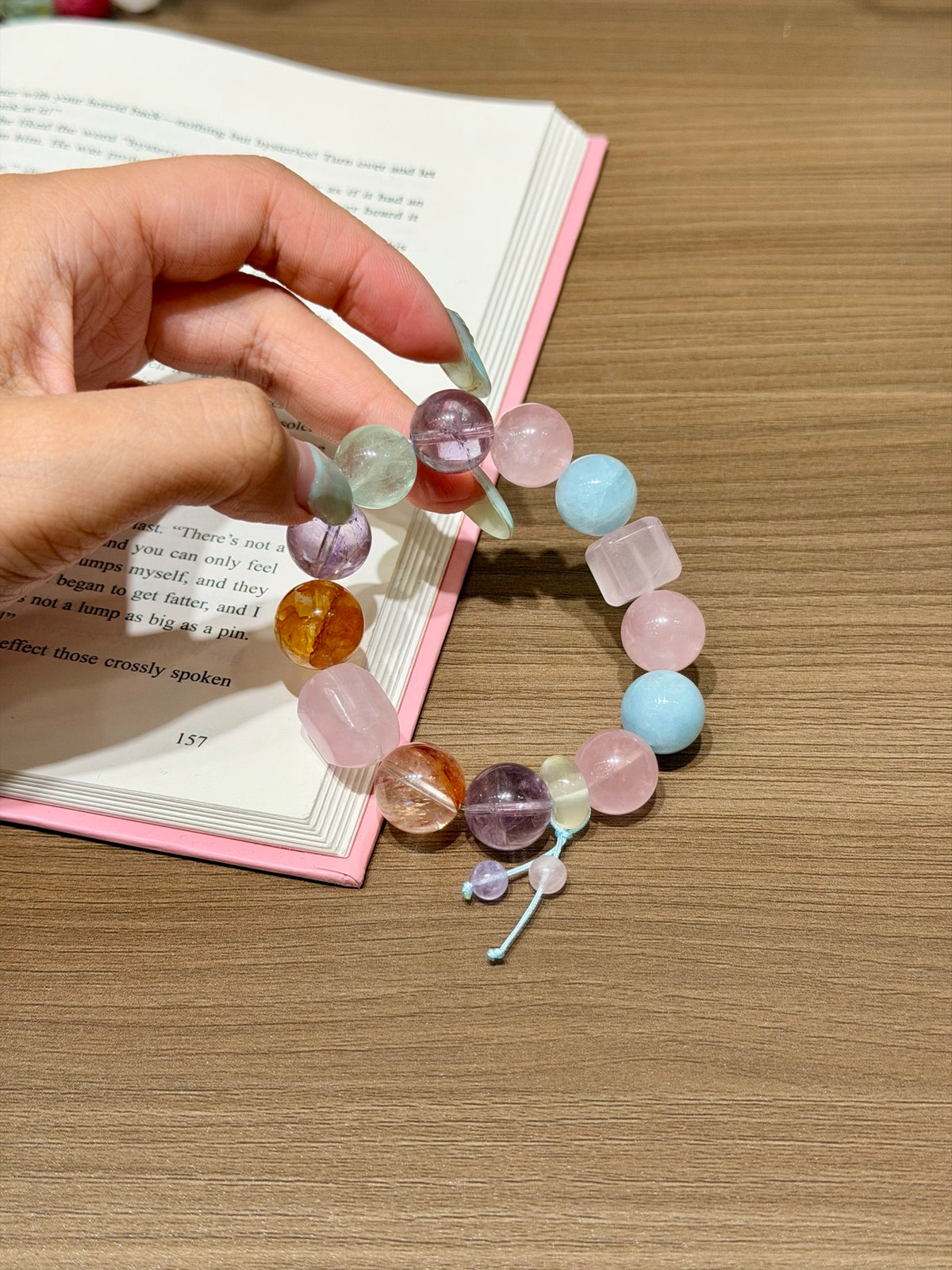 Spring Candy Jar pastel crystal candy bracelet with blue cord dangle worn on wrist