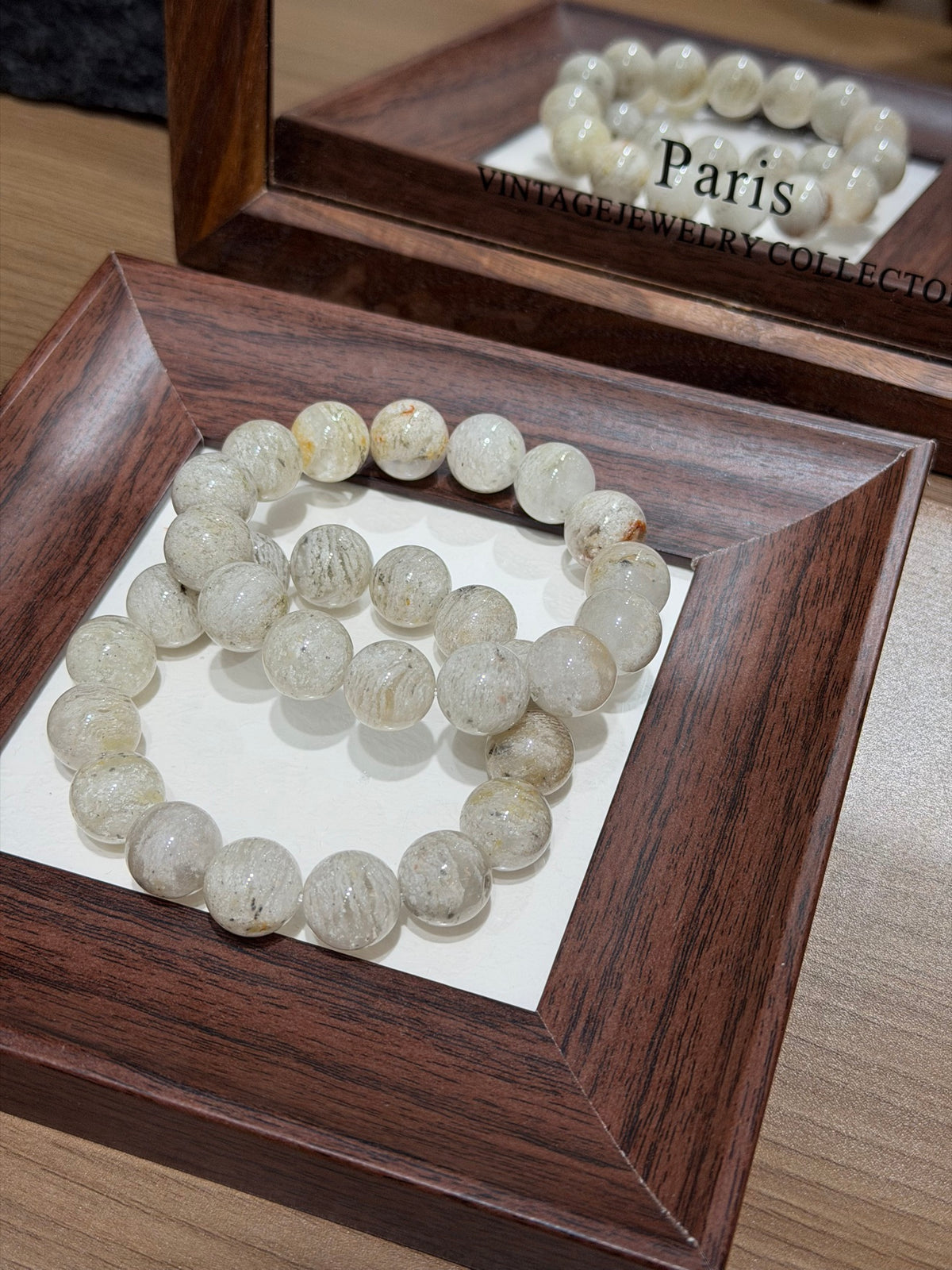 Thousand-Layer Phantom Quartz Bracelet in wooden tray