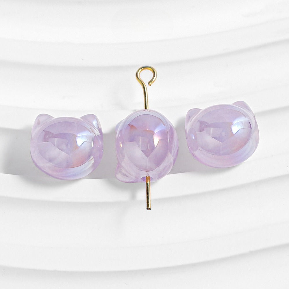 Three lavender purple cat-shaped beads with glossy faceted finish and gold metal hanger.