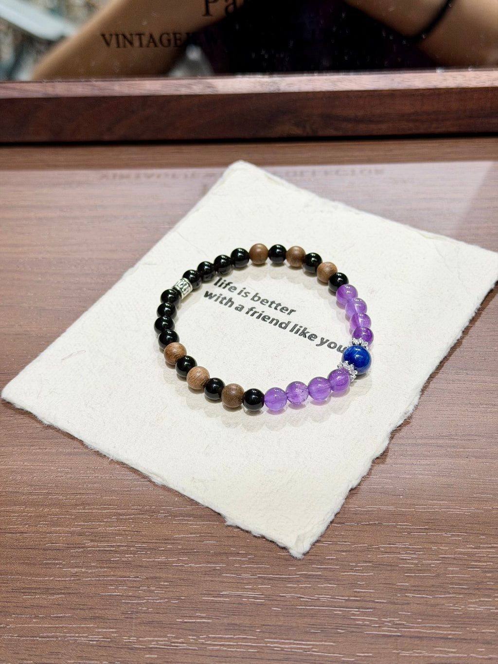 Dusk mountain bracelet with sandalwood and kyanite on card