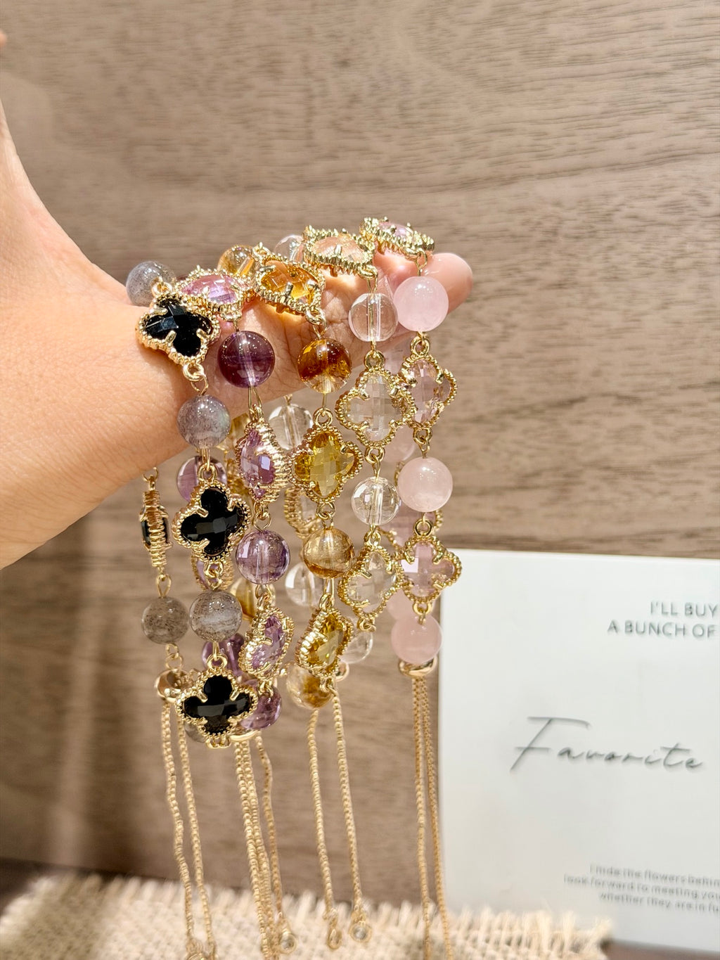 Five four-leaf clover crystal bracelets in yellow, white, purple, pink and black