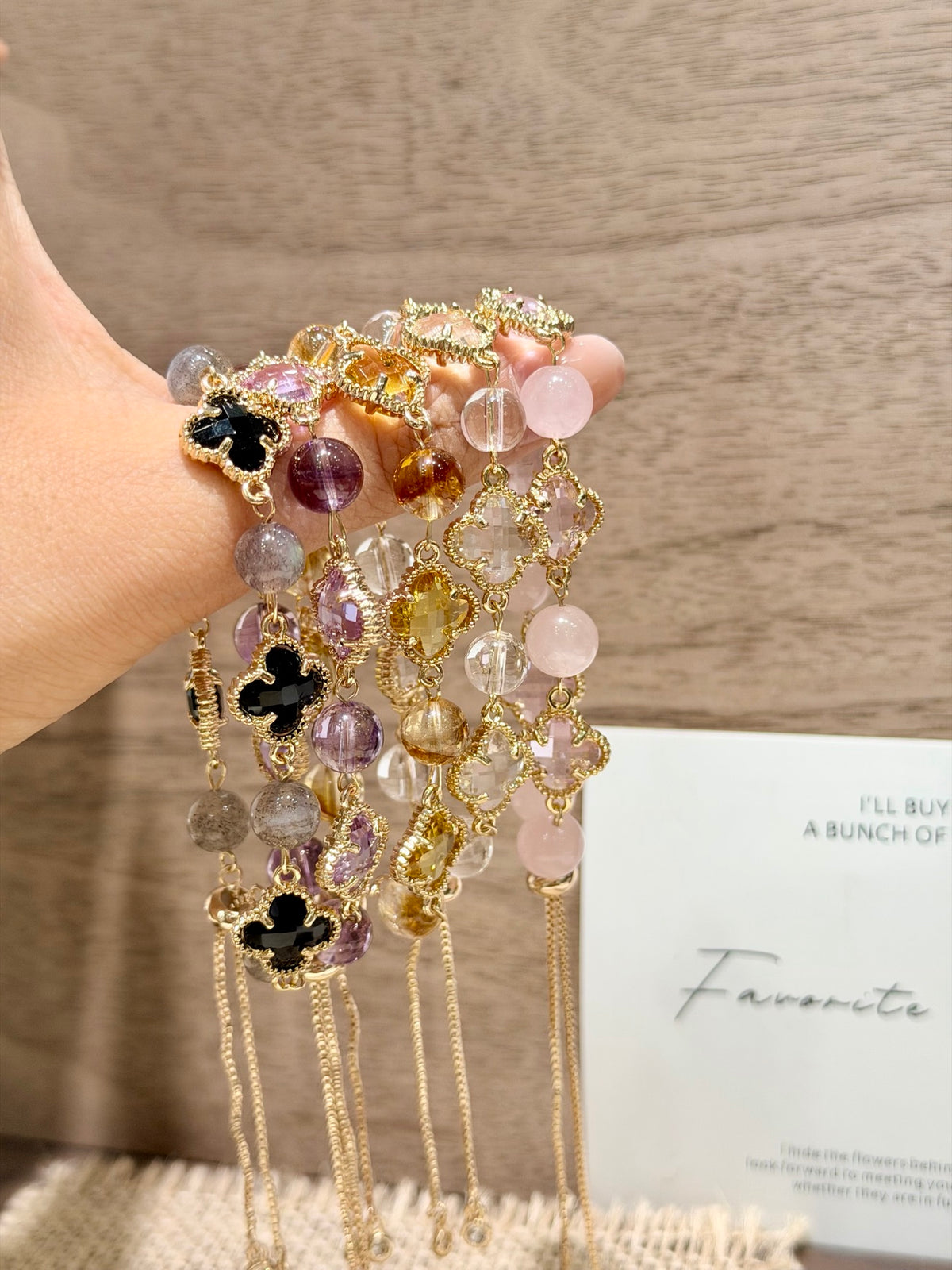 Five four-leaf clover crystal bracelets in yellow, white, purple, pink and black