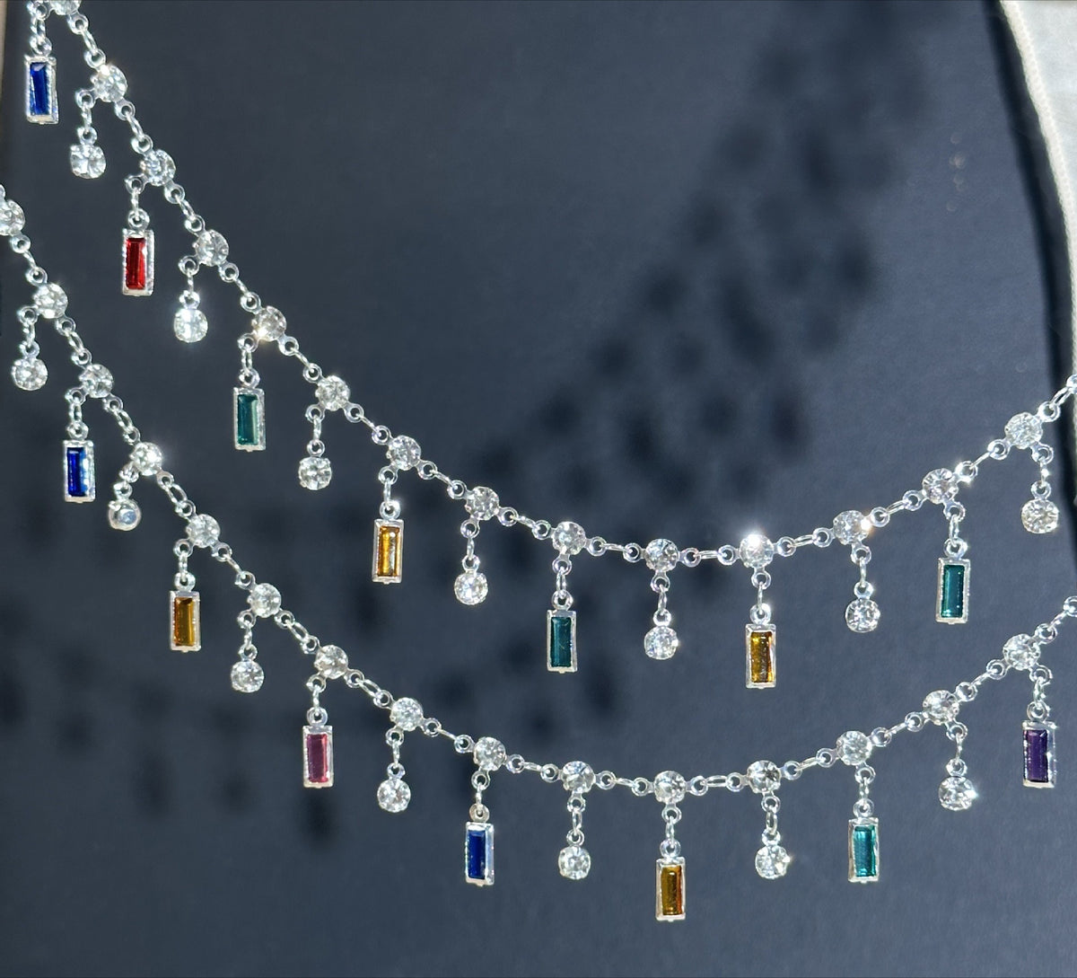 Silver-tone double-strand chain with dangling clear round beads and small rectangular colorful crystals