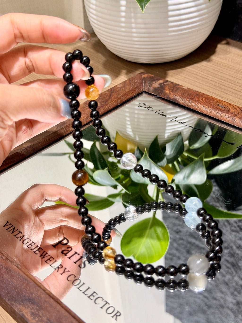 Dark Current Bracelet held over mirror tray