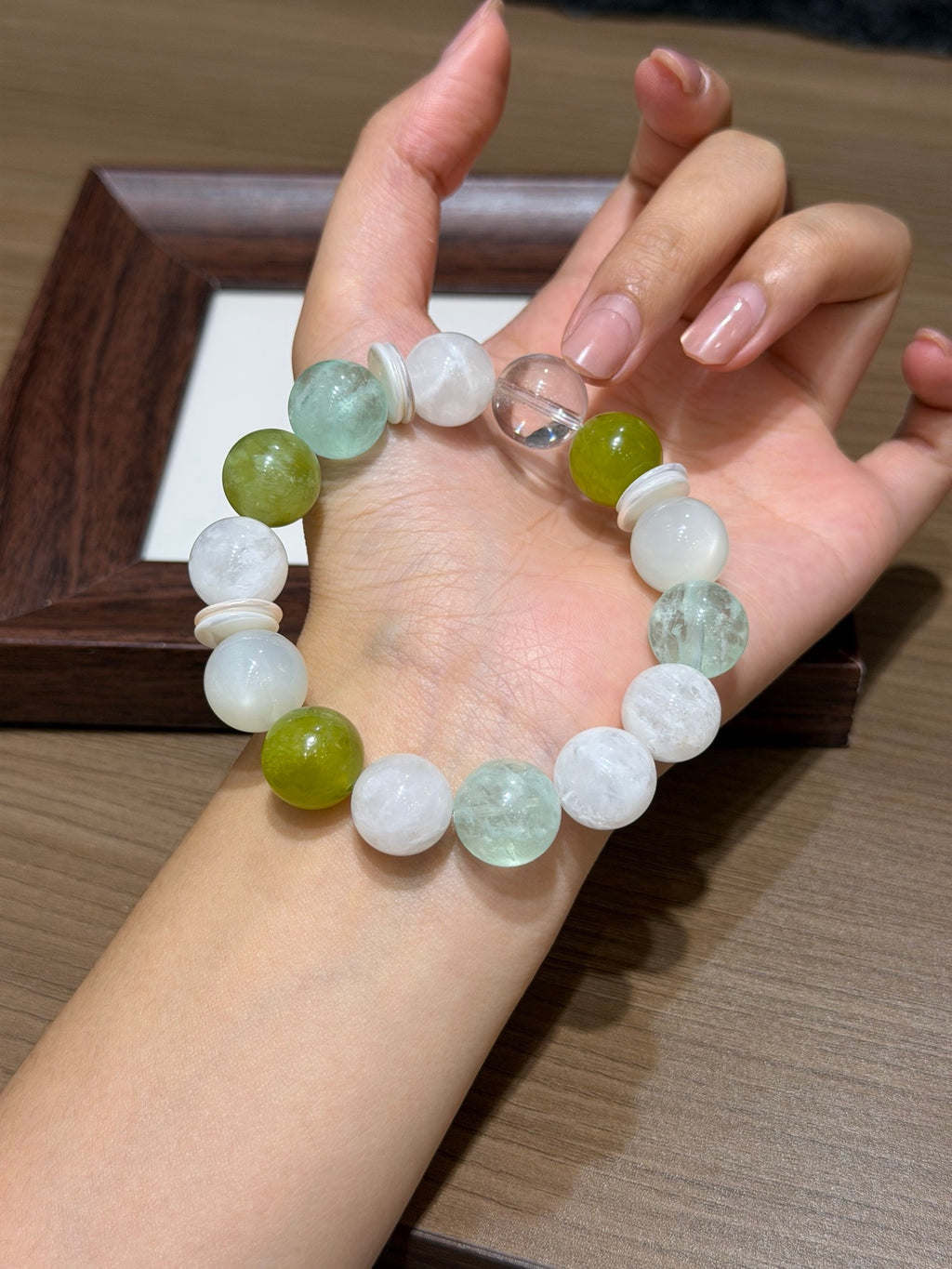 Spring stream bracelet with green fluorite and moonstone worn on wrist