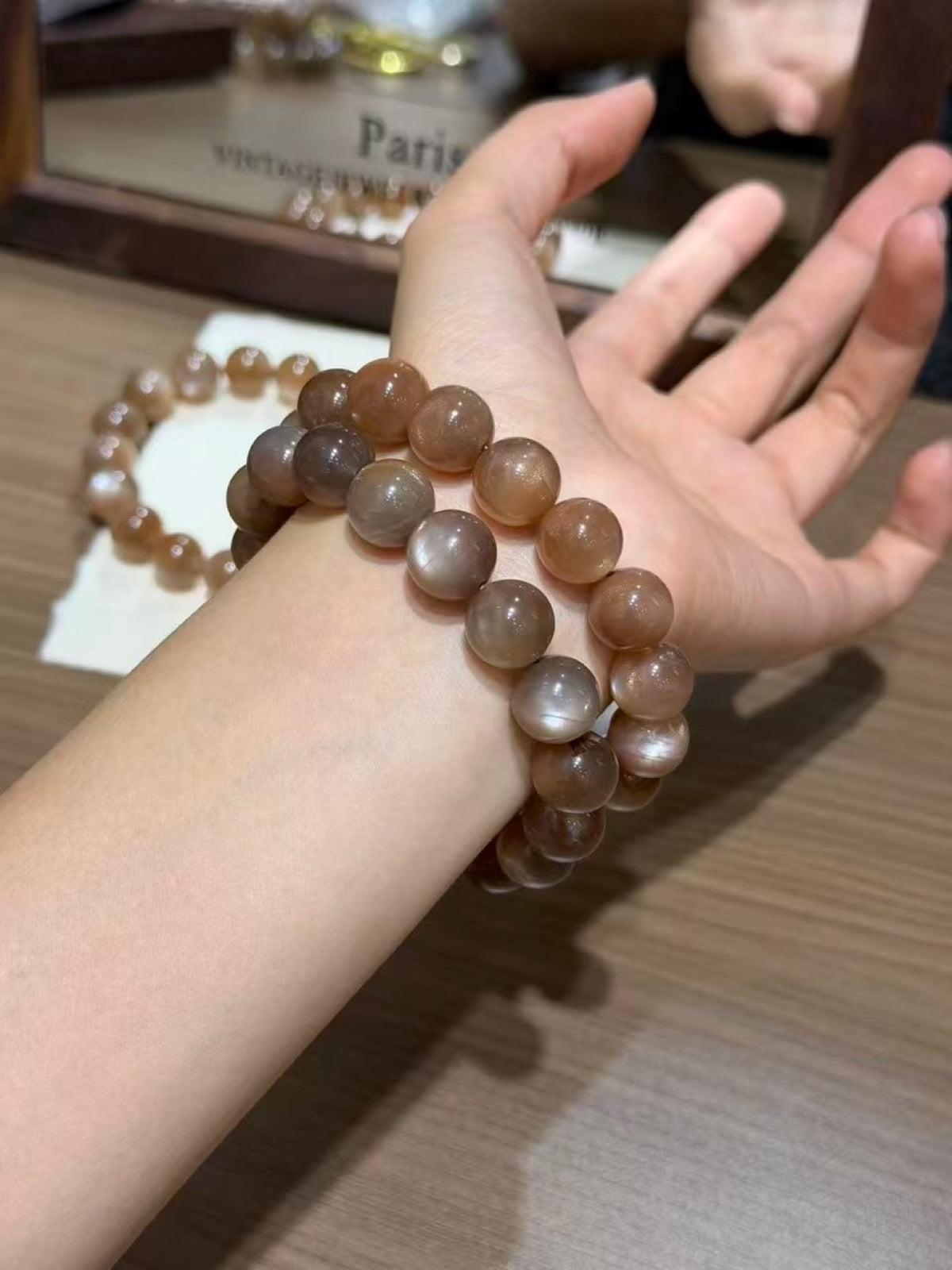 Milk tea moonstone plain strand bracelet wrapped on wrist