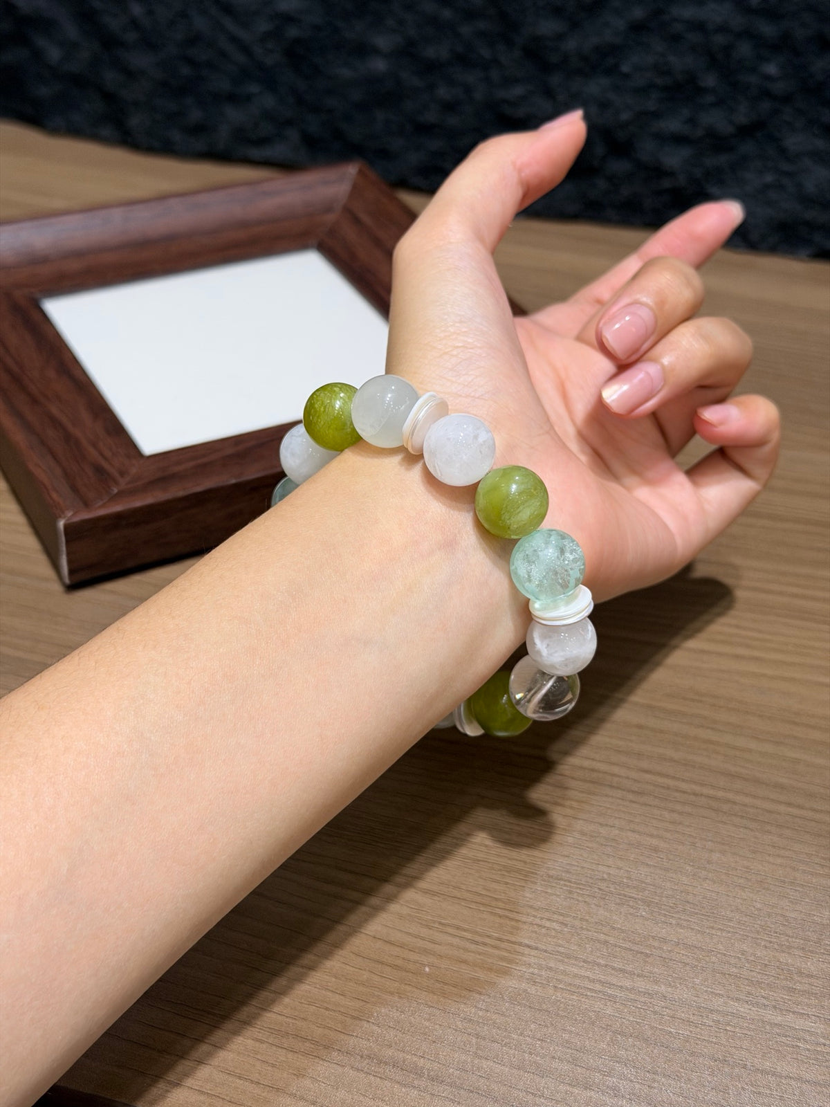 Close-up of spring stream bracelet with Xiuyan jade on wrist