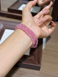 Rhodonite triple-wrap bracelet worn on wrist