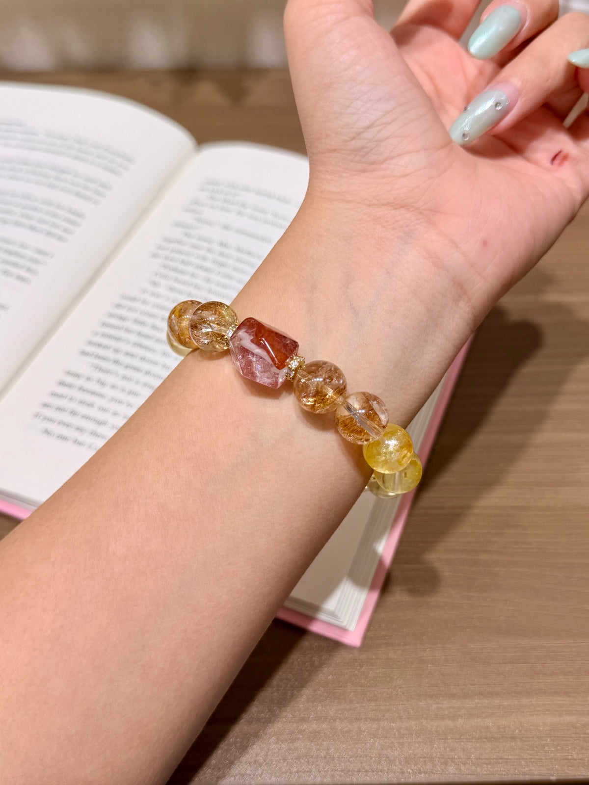 Gold and yellow hematoid quartz bracelet with red freeform bead on Thank You card