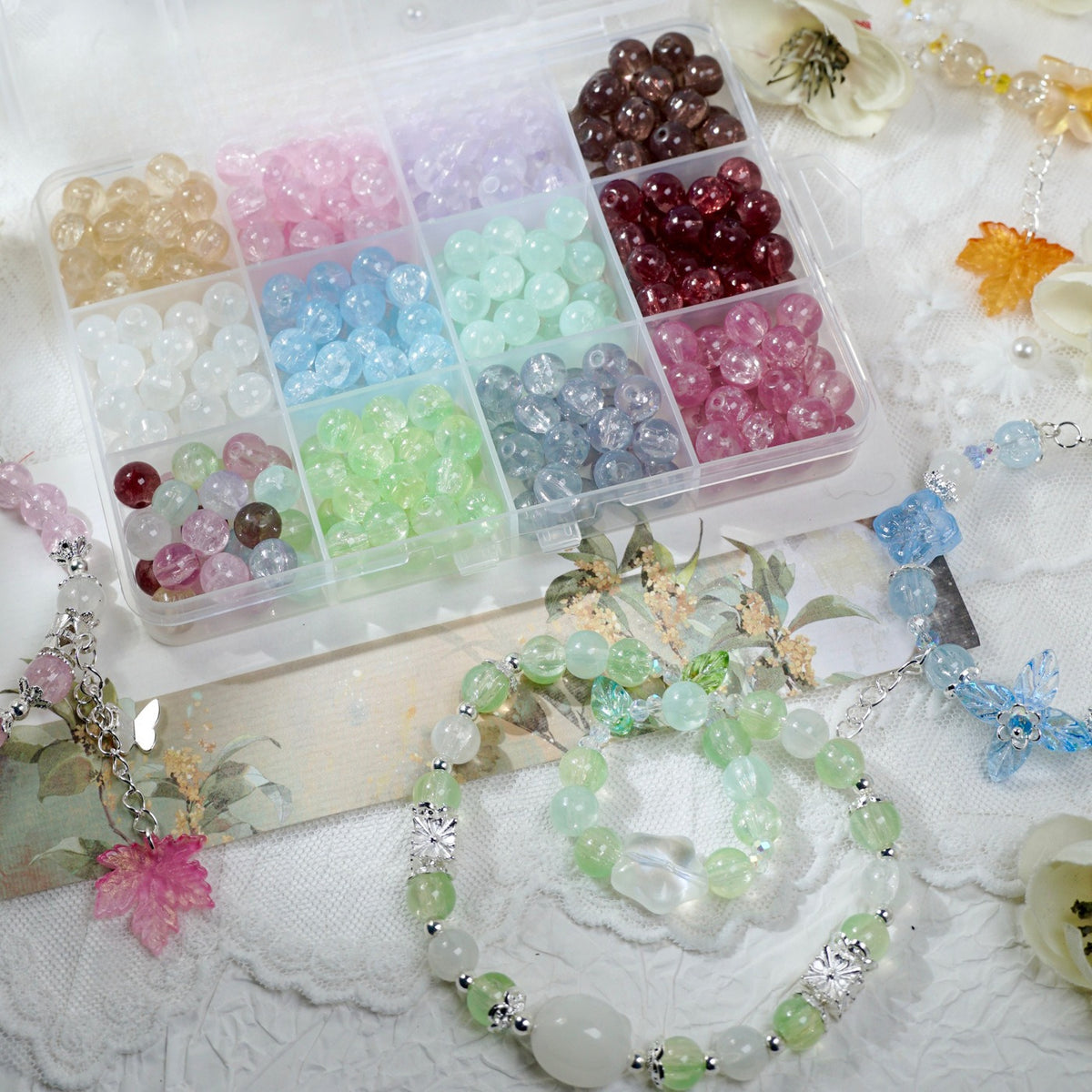Compartment box of multicolor translucent glass beads with finished bracelets