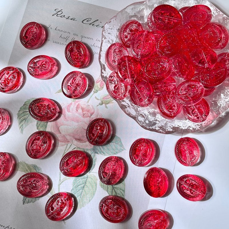 Red translucent oval engraved glass beads on vintage floral print