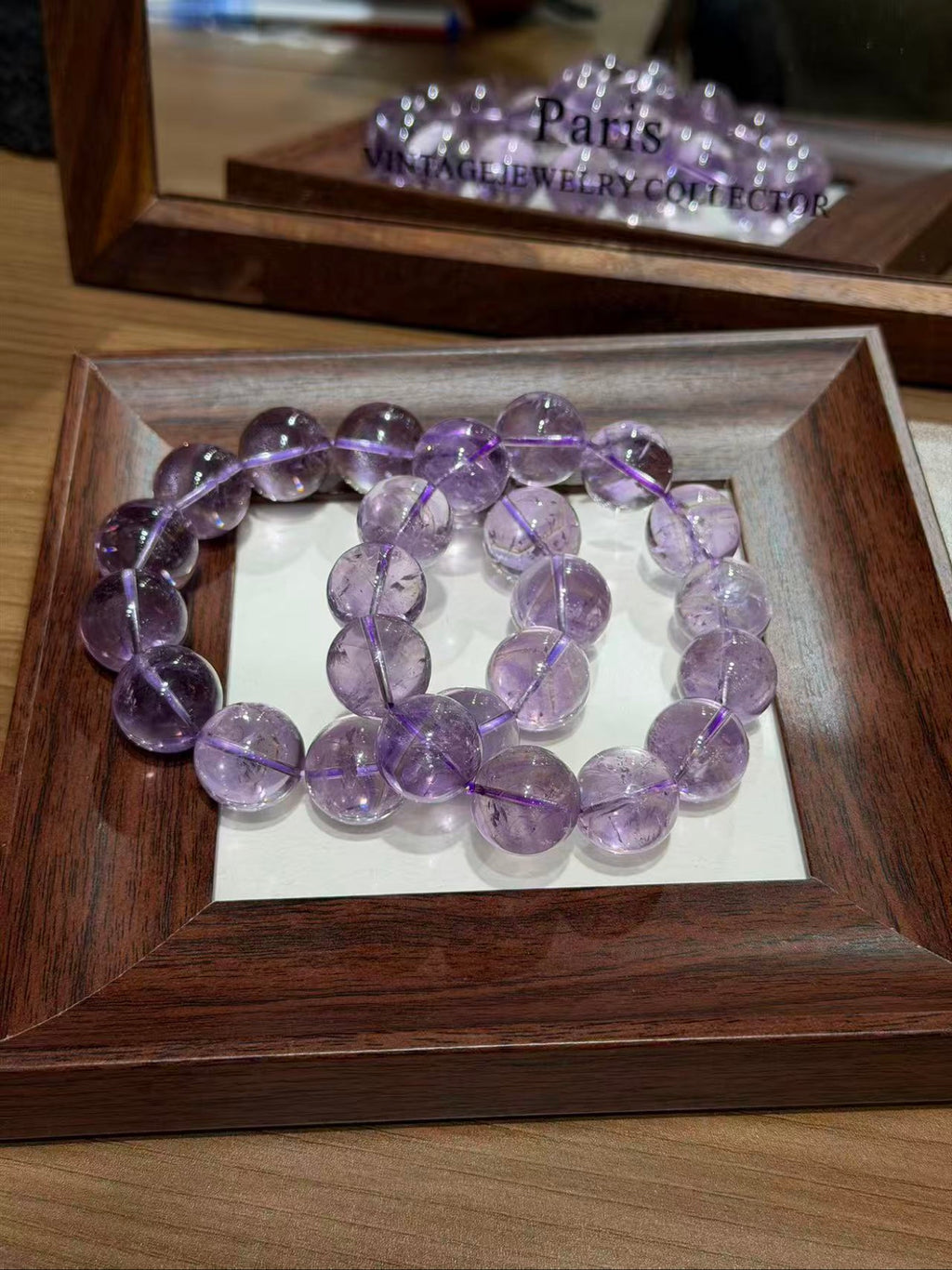 Bolivian amethyst bracelet strands coiled on a tray