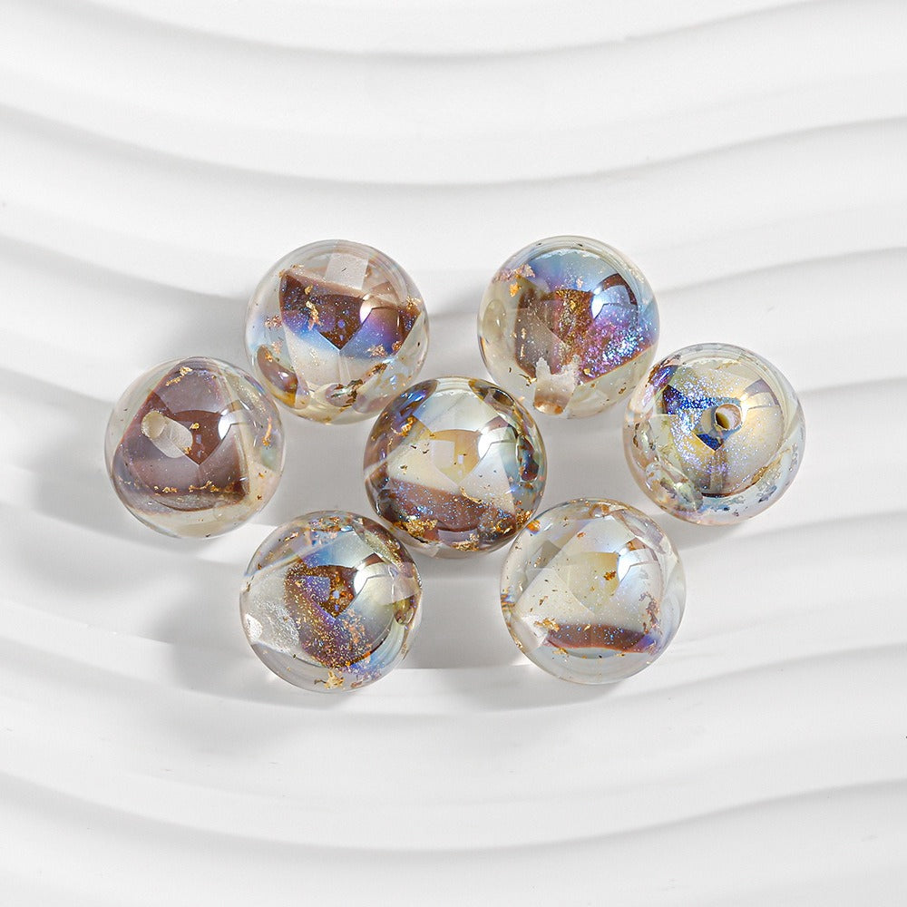 Seven faceted resin beads with iridescent metallic finish