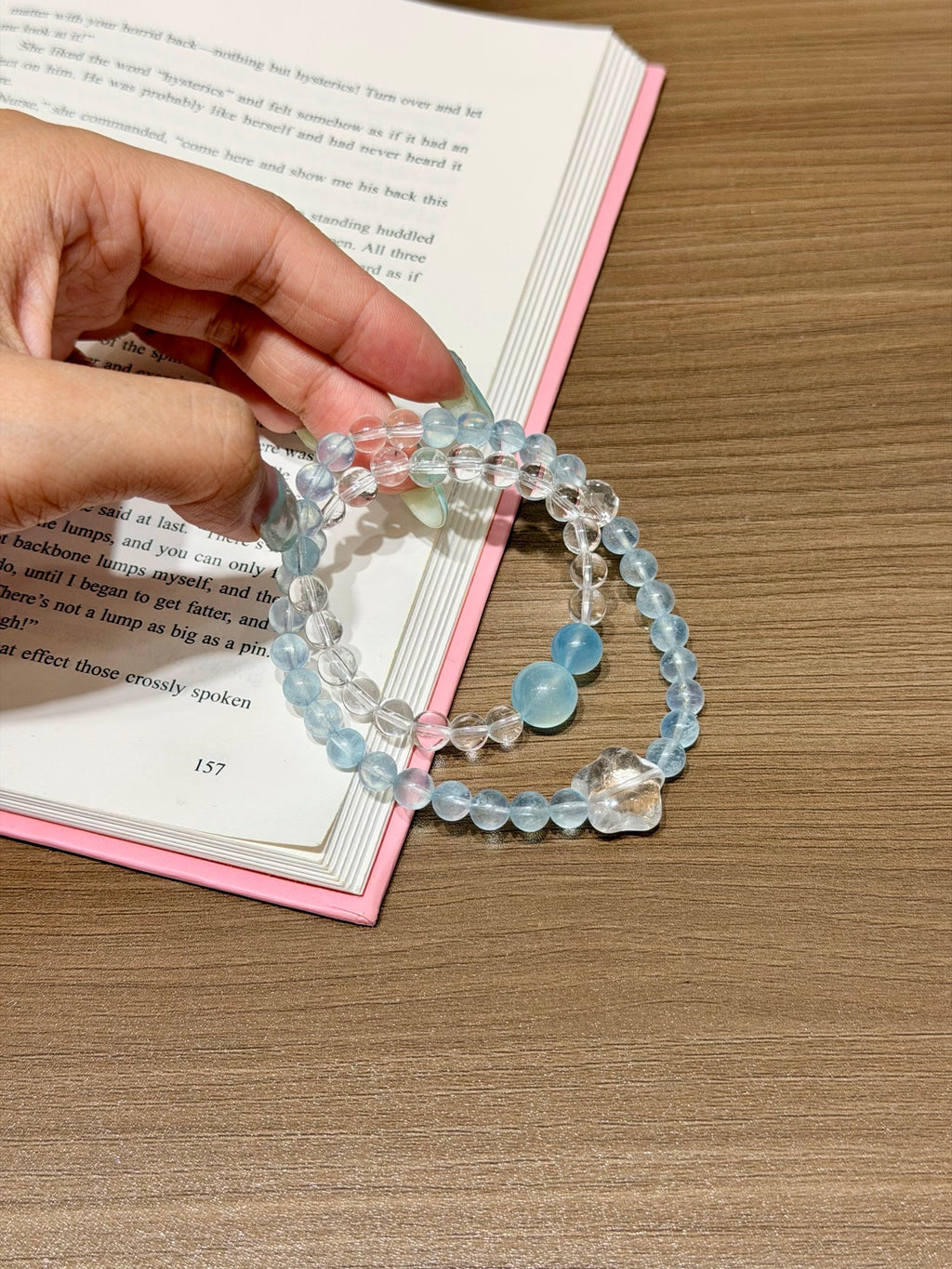 Ocean Starfall double-loop bracelet with aquamarine and white quartz beads worn on wrist