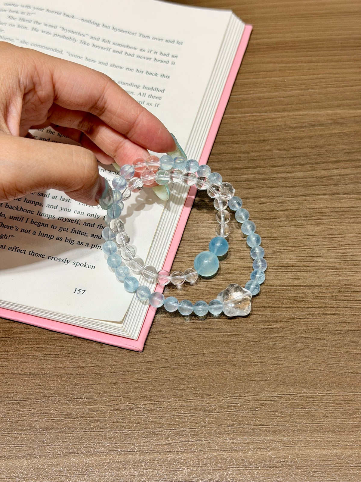 Ocean Starfall double-loop bracelet with aquamarine and white quartz beads worn on wrist