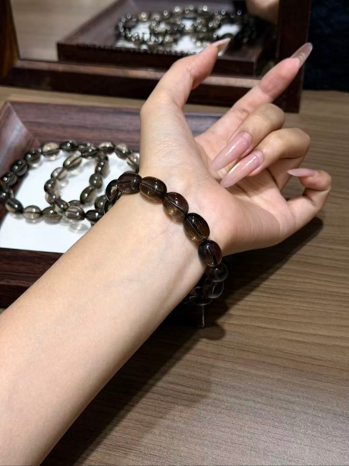 Smoky quartz jelly bean bracelet worn on wrist
