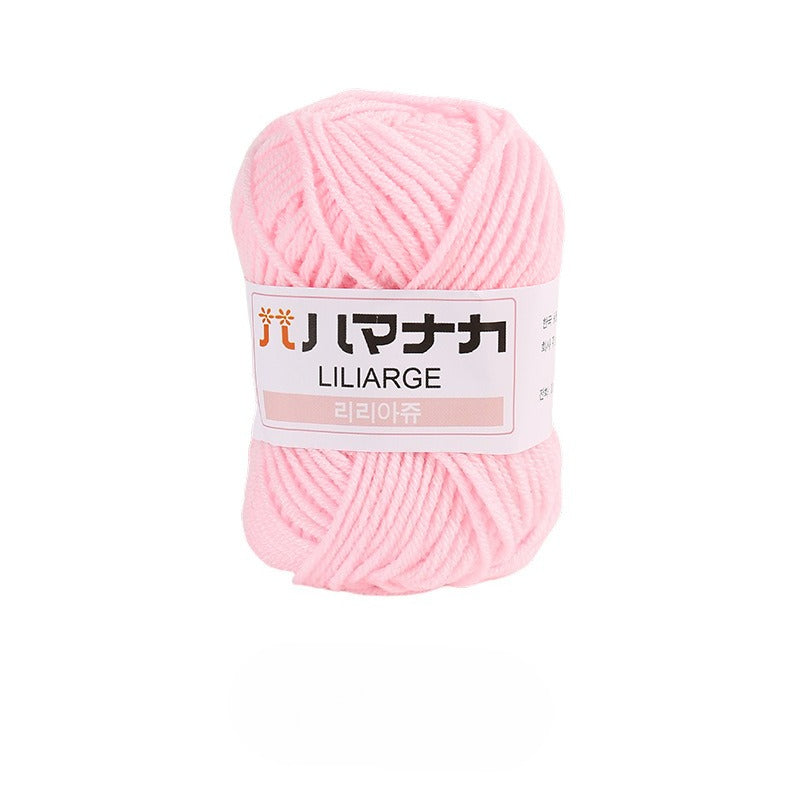 A ball of light pink yarn with a white paper label wrapped around it, photographed on a clean white background. The label features the brand name 'LILILARGE' in English and Japanese characters.