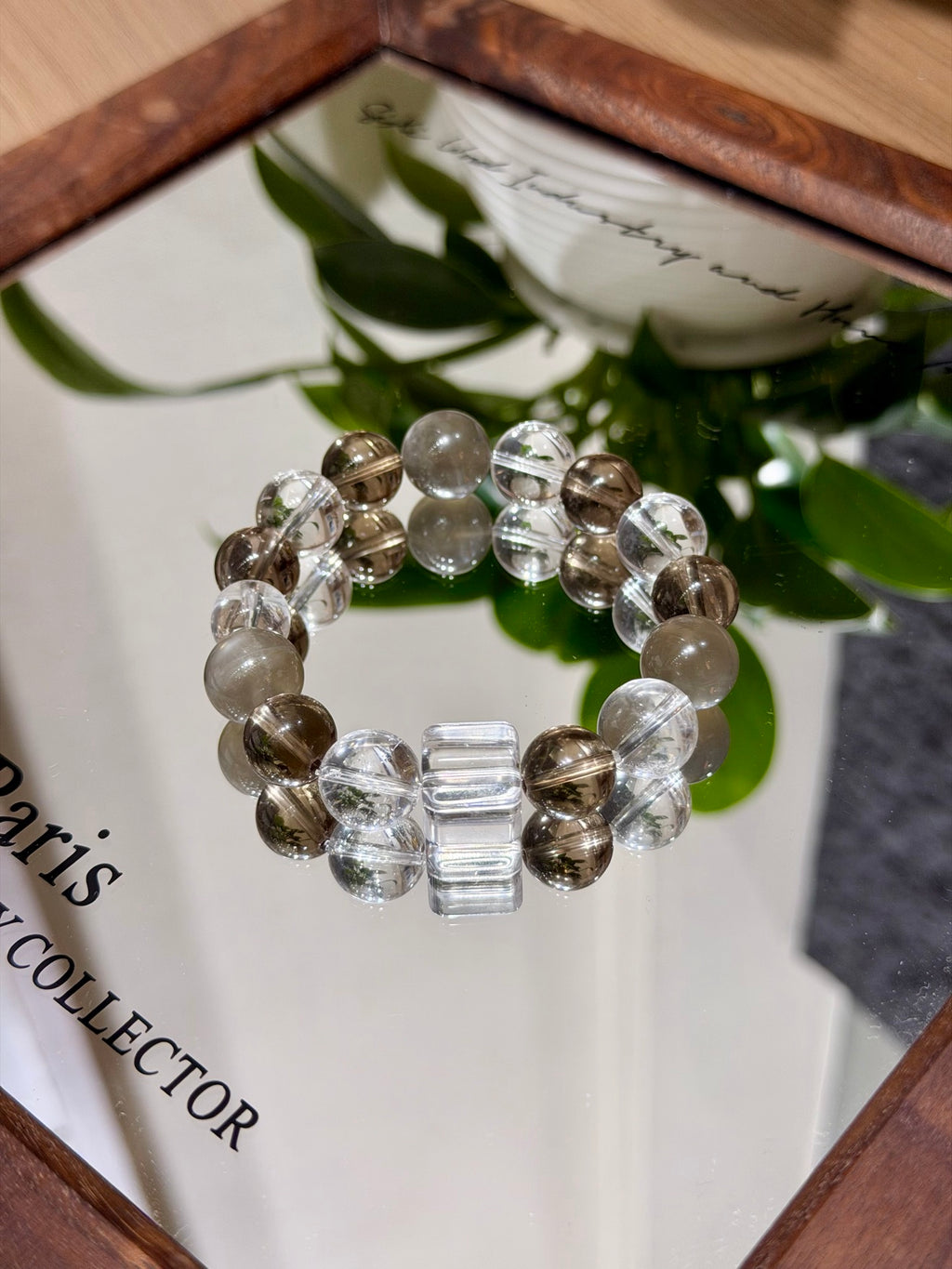 Misty coffee bracelet with sugar-cube beads on mirror tray
