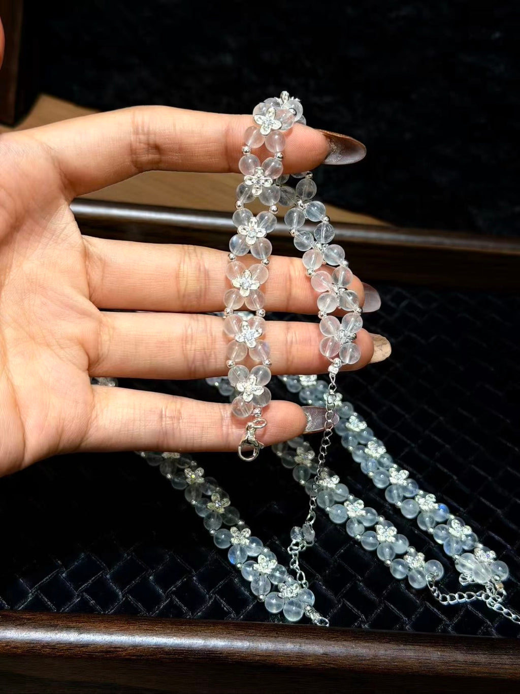 Blue Moonstone Woven Bracelet held in hand