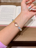 Sea frost white crystal bracelet with aquamarine worn on wrist