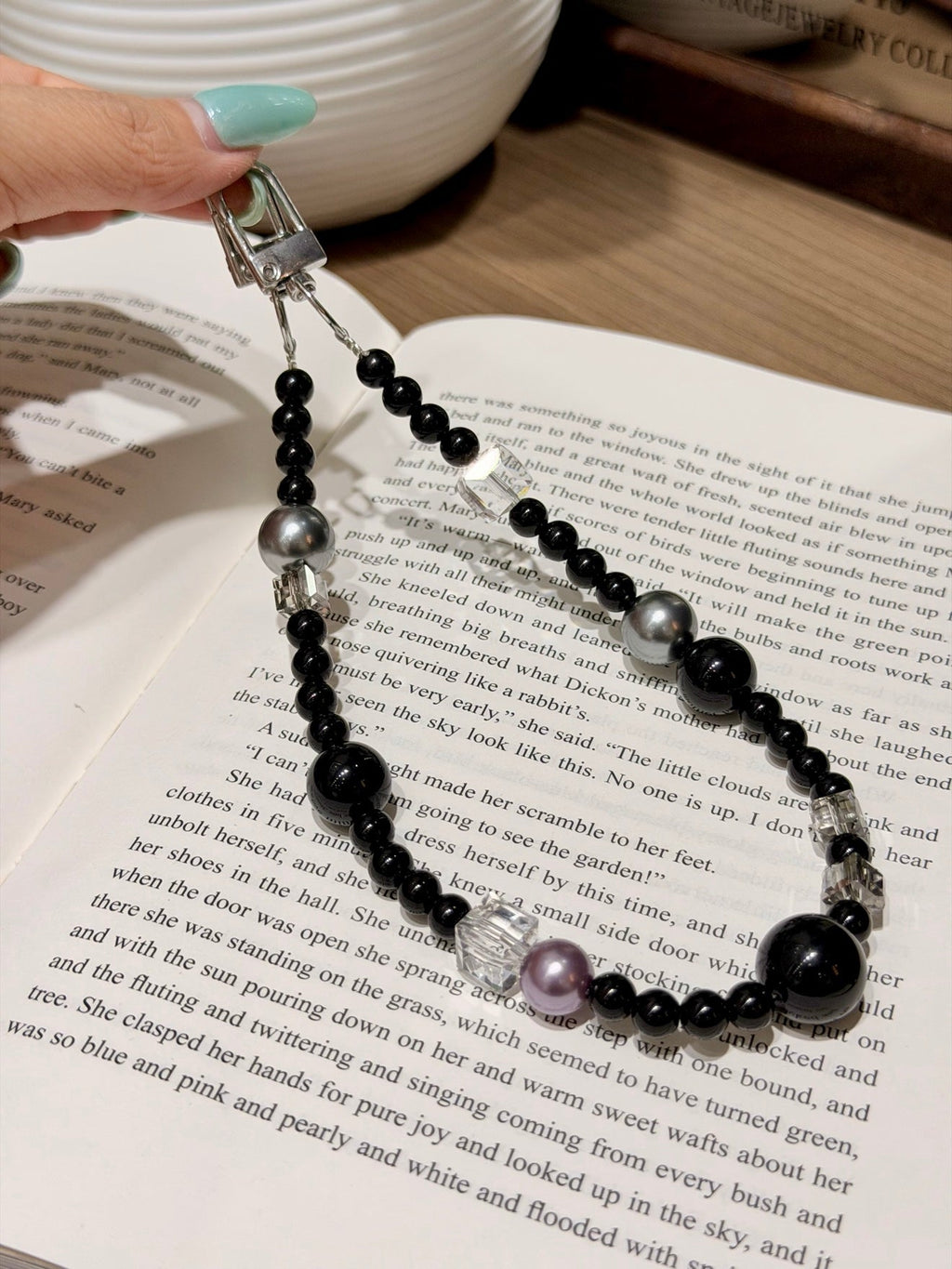 Bag charm with black obsidian beads, silver-gray pearls, clear quartz cubes and lavender pearl accent.