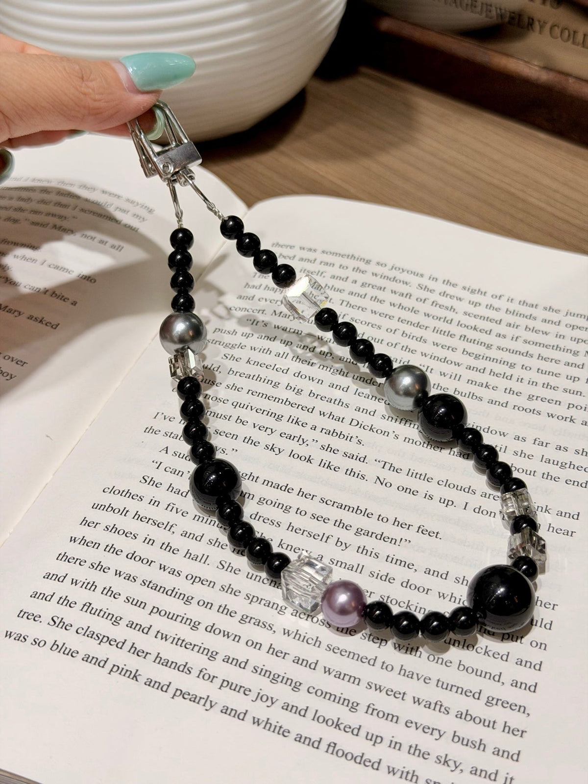 Bag charm with black obsidian beads, silver-gray pearls, clear quartz cubes and lavender pearl accent.
