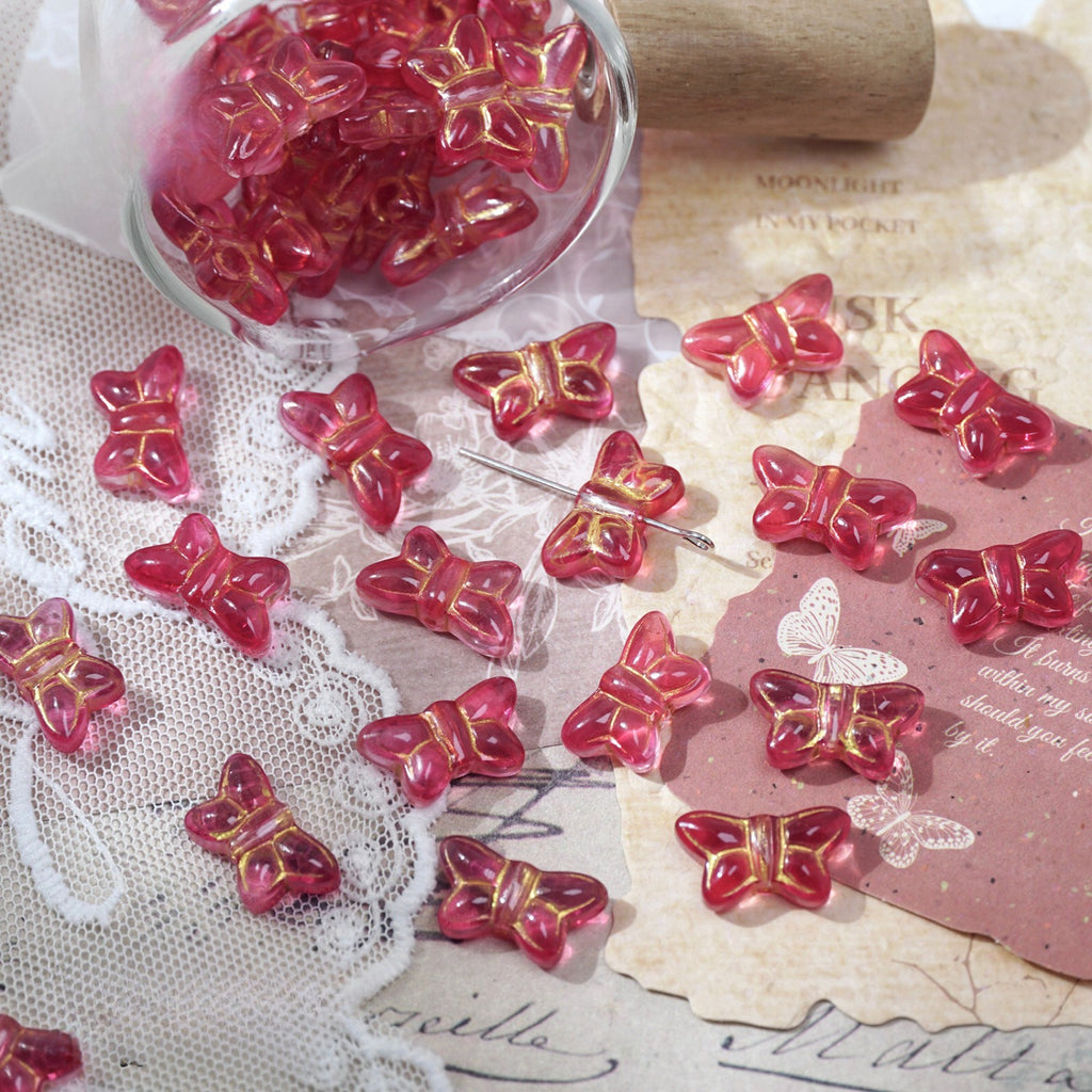 Pink translucent 10x18mm vintage Czech-style glass butterfly beads with gold foil