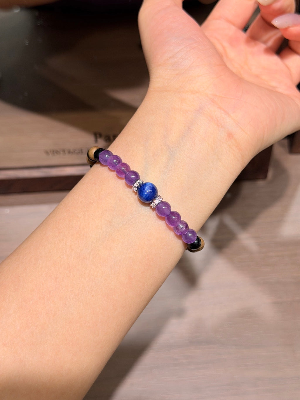 Dusk mountain amethyst sandalwood bracelet with kyanite worn on wrist