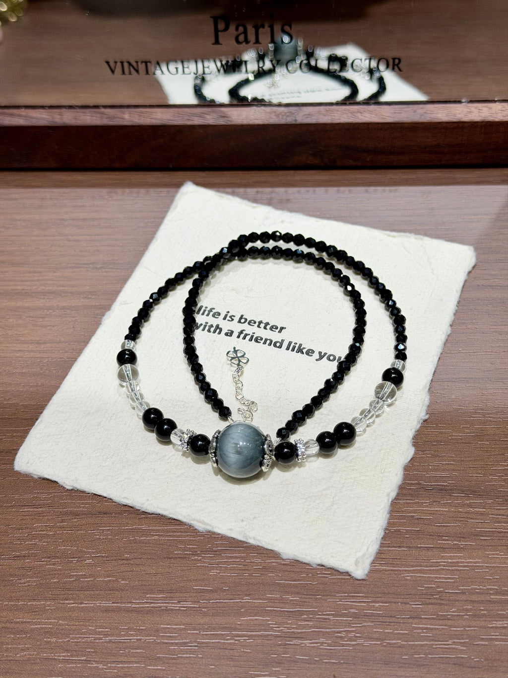 Night Hawk's Eye Necklace coiled on cloth