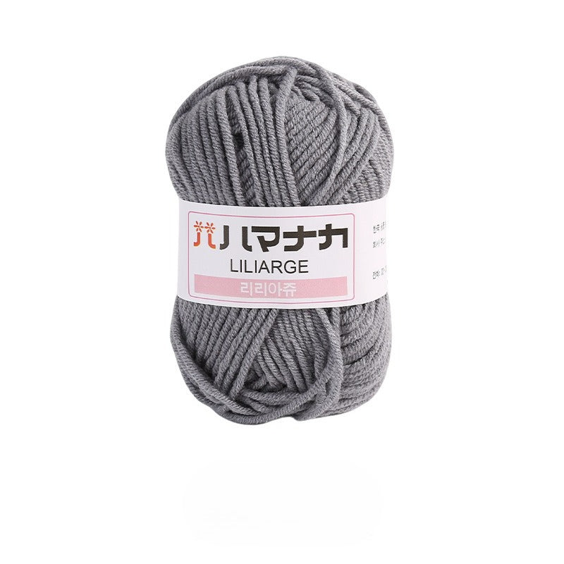 Grey 4-ply milk cotton-acrylic yarn skein with white LILIARGE label on white background