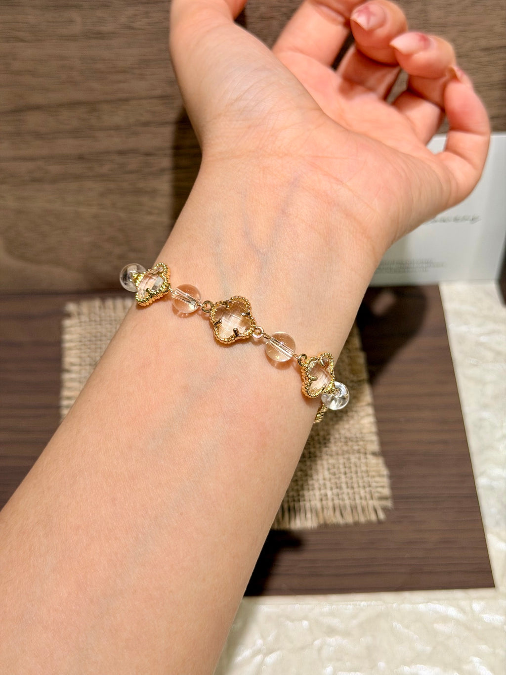 Clear Light white crystal four-leaf clover bracelet on wrist