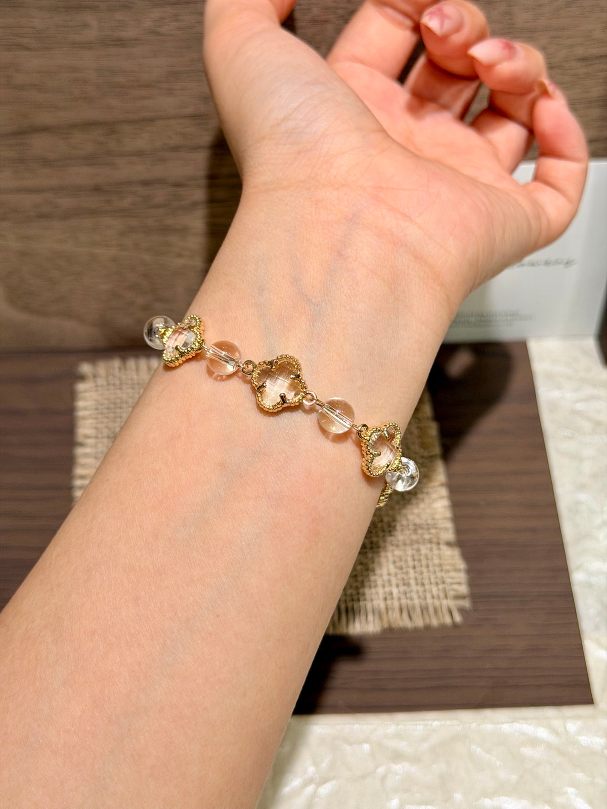 Clear Light white crystal four-leaf clover bracelet on wrist