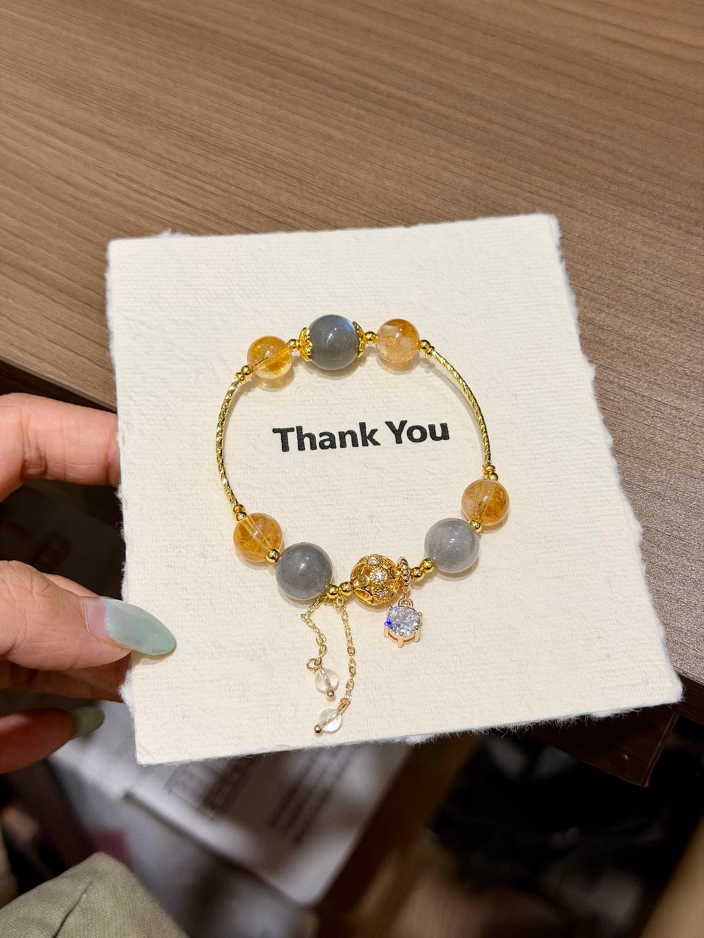 Thin gray moonstone and golden yellow tower crystal bracelet with chain tassel and zircon pendant