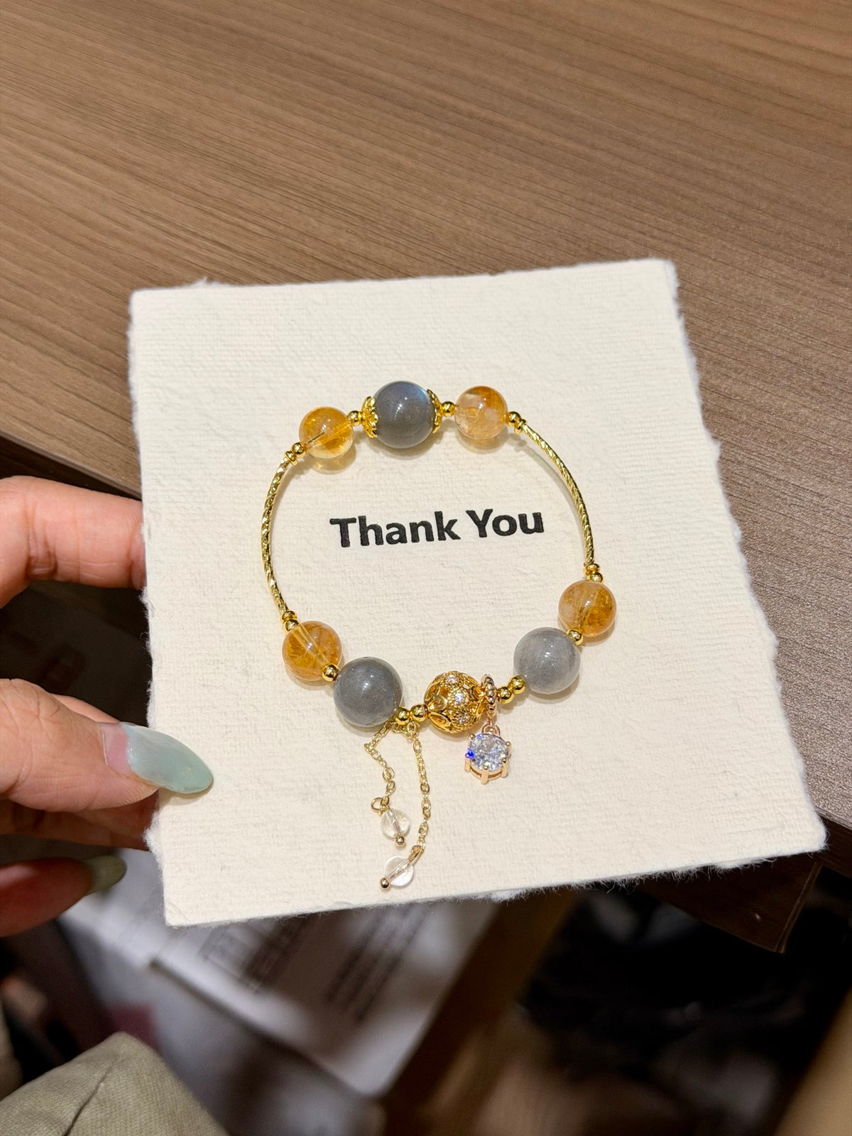 Thin gray moonstone and golden yellow tower crystal bracelet with chain tassel and zircon pendant