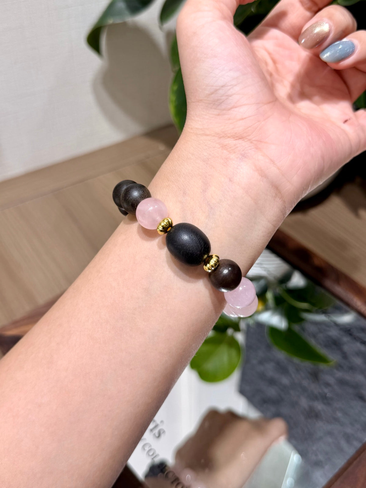 Pink Quartz & Agarwood Bracelet worn on wrist