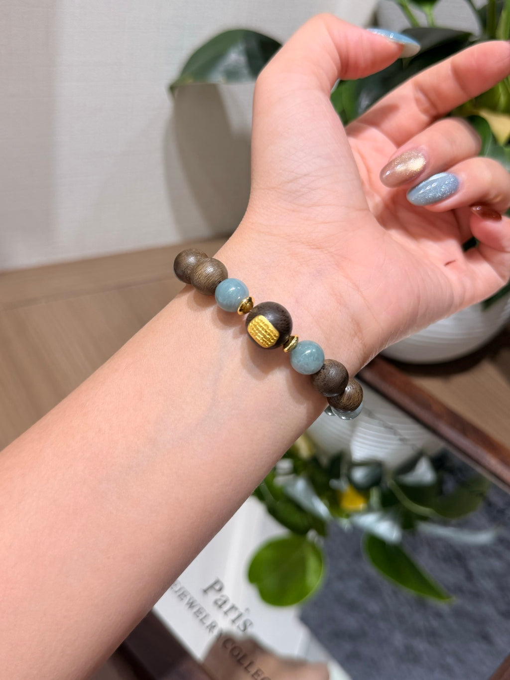 Blue Water Jadeite & Sandalwood Bracelet worn on wrist
