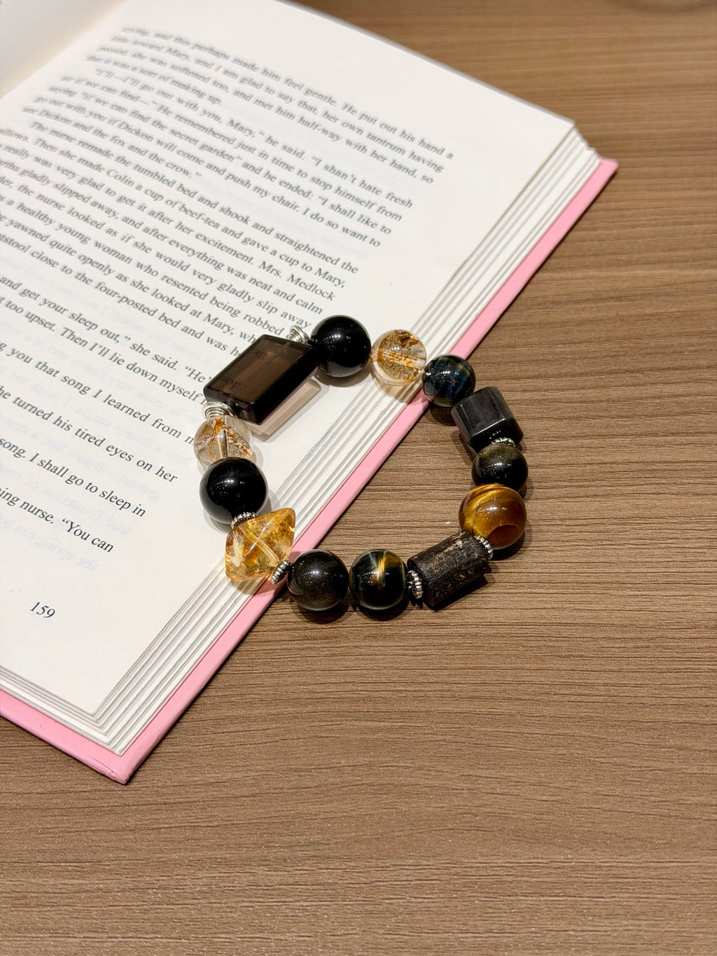 Gold Obsidian & Tiger's Eye Bracelet on open book