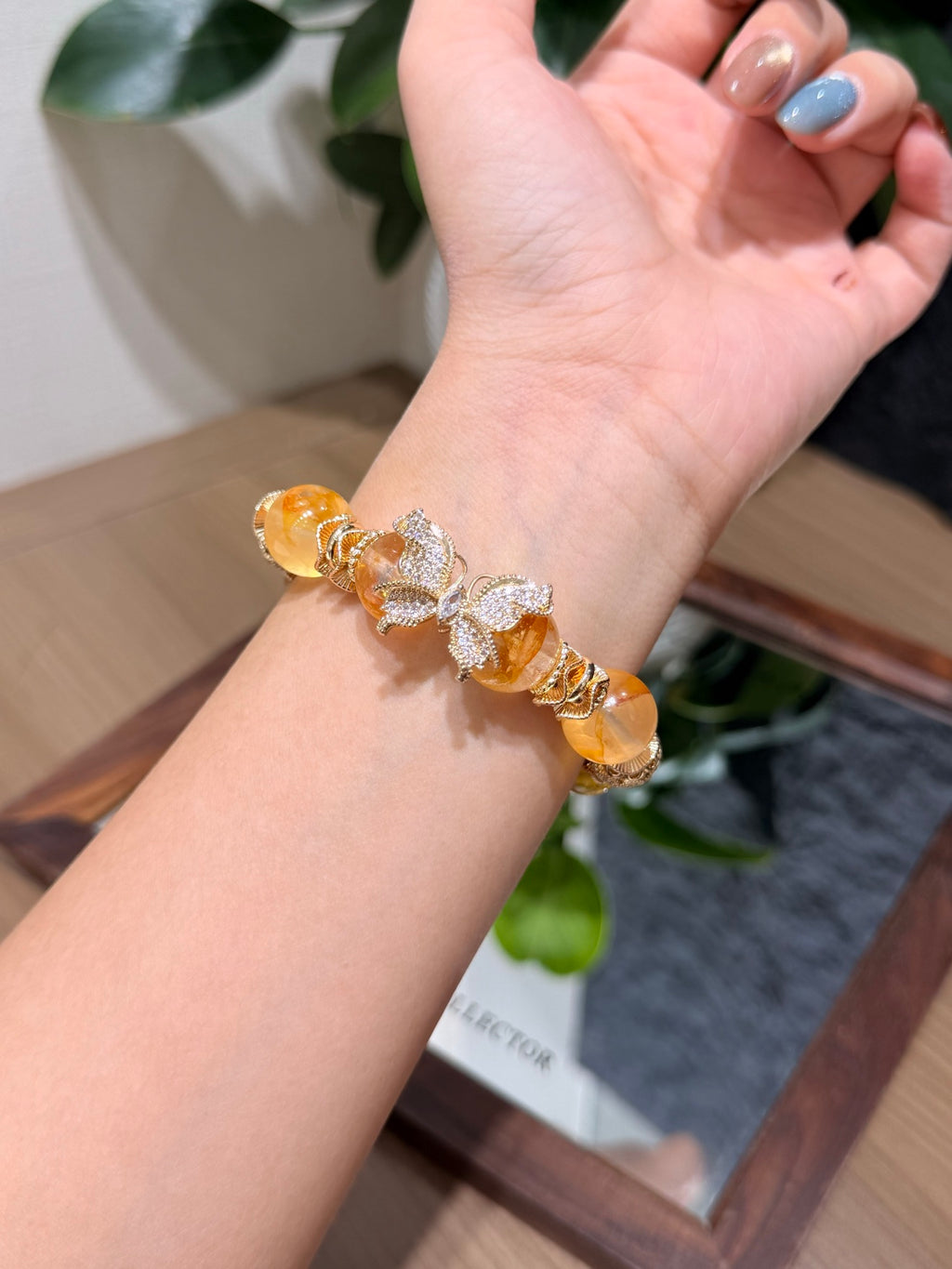 Yellow Phantom Quartz Butterfly Bracelet worn on wrist