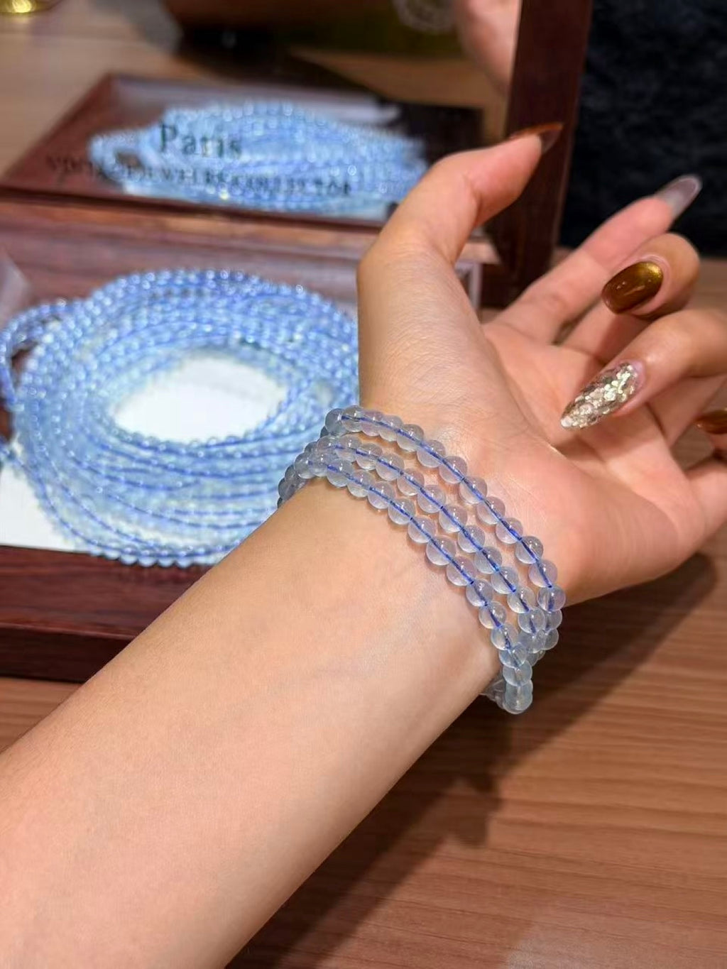 Aquamarine Triple Wrap Bracelet worn on wrist