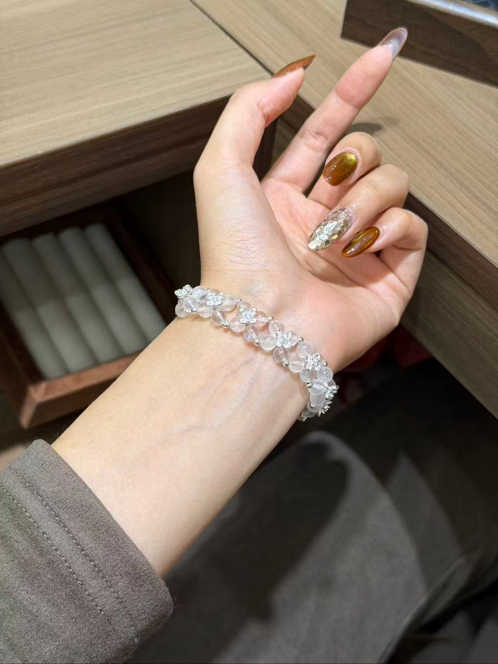 Blue Moonstone Woven Bracelet on green tabletop