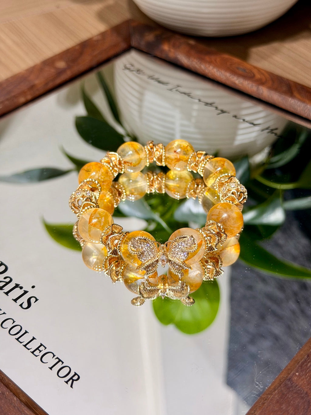 Yellow Phantom Quartz Butterfly Bracelet on mirror tray