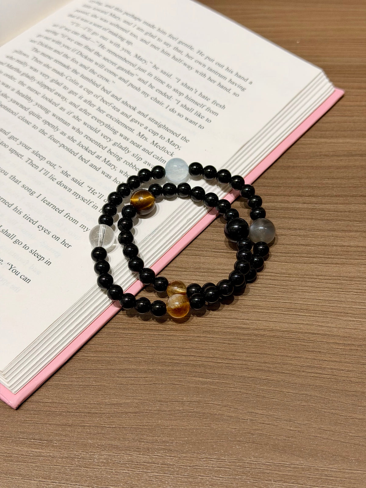 Dark Current Bracelet on open book