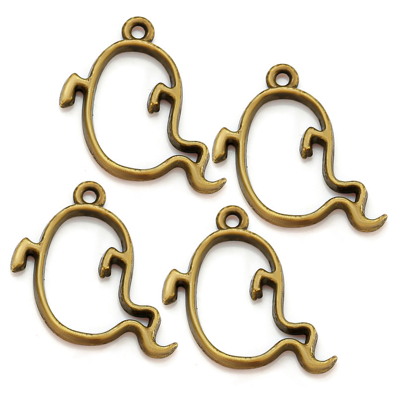 Four antique bronze ghost-shaped metal charms with hanging loops on a white background