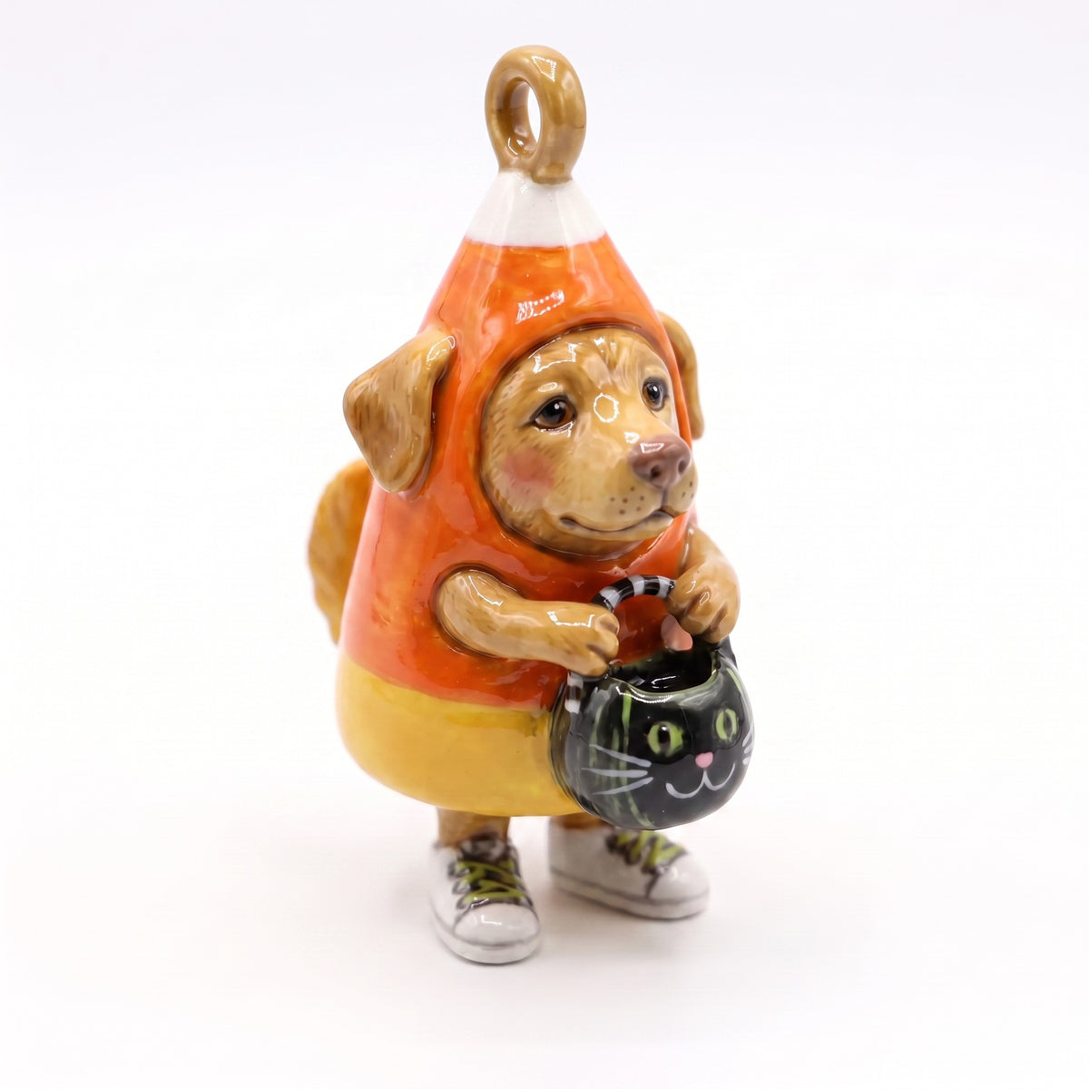 3D puppy pendant charm in orange and yellow candy corn costume with black cat detail.