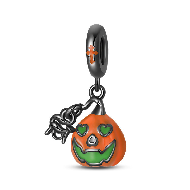 Black-plated pumpkin dangle charm with orange pumpkin, green heart eyes and smile, orange cross on bail