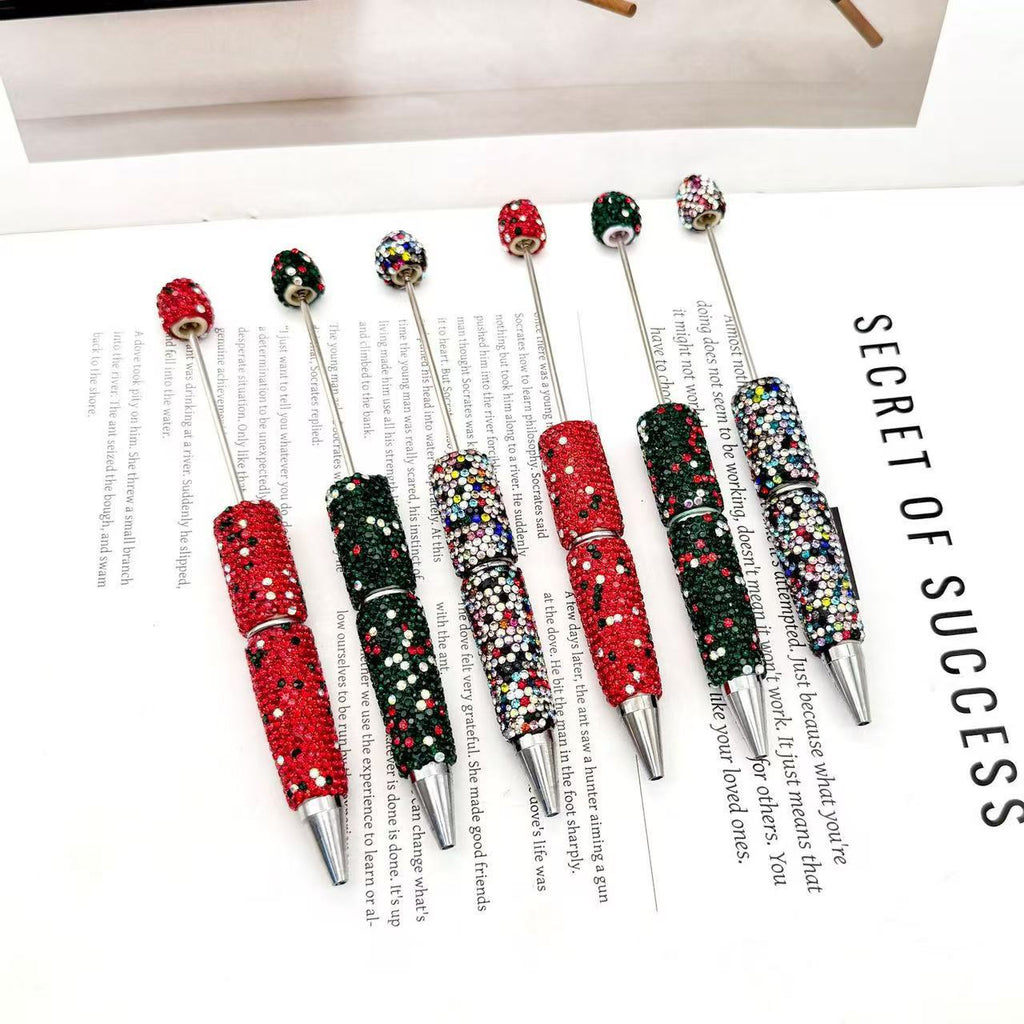 Six decorative ballpoint pens with rhinestone-embellished barrels and metallic silver tips