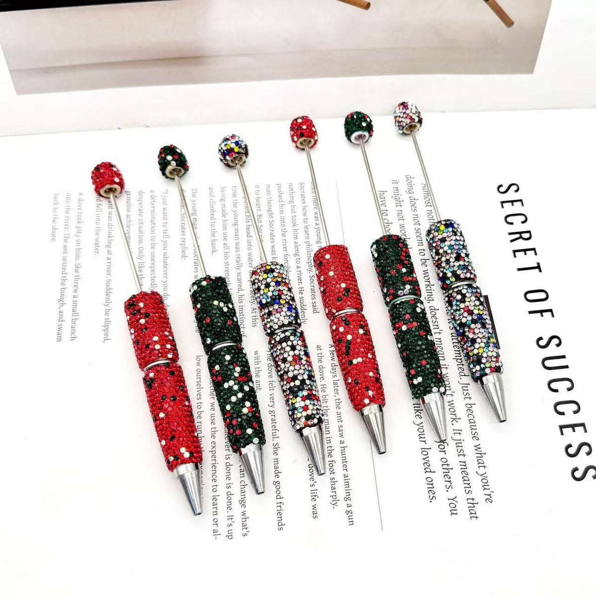 Six decorative ballpoint pens with rhinestone-embellished barrels and metallic silver tips