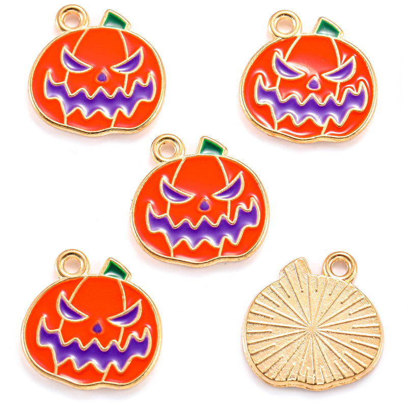 Five pumpkin-shaped charms with orange enamel and purple jack-o'-lantern faces